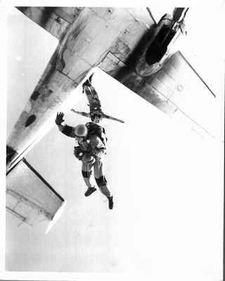 Tom exiting the airplane